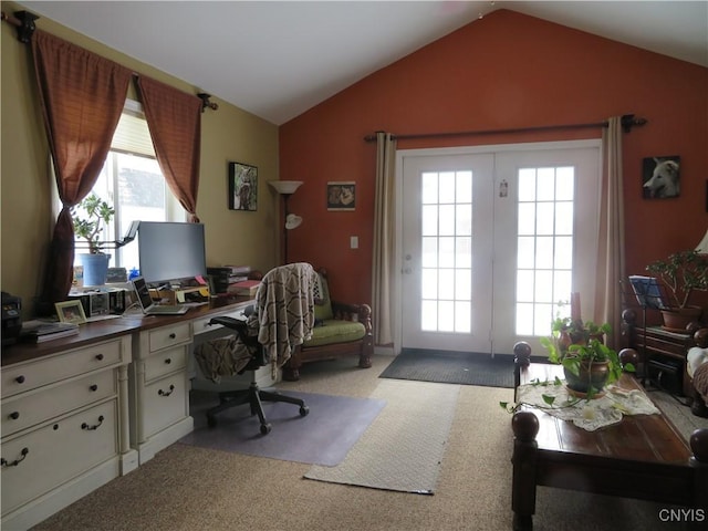 carpeted office featuring vaulted ceiling