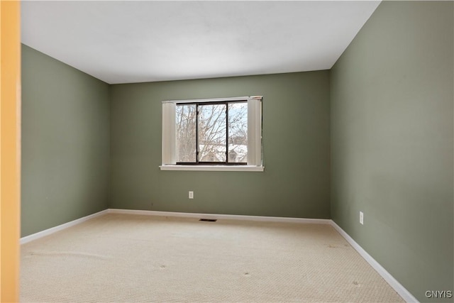 unfurnished room with carpet flooring