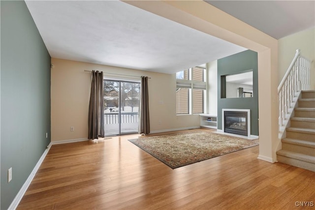 unfurnished living room with light wood-type flooring