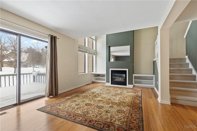 unfurnished living room with light hardwood / wood-style floors