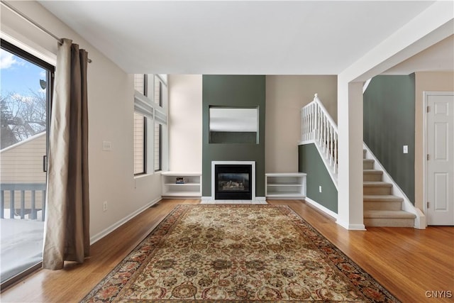 unfurnished living room with hardwood / wood-style flooring