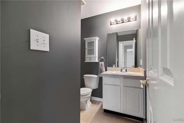 bathroom featuring toilet and vanity