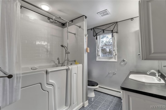 bathroom with a baseboard heating unit, vanity, and toilet