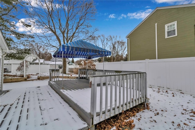 view of snow covered deck