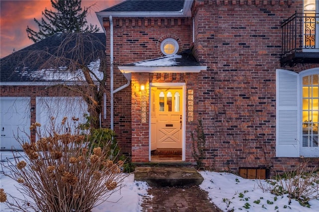 view of snow covered property entrance