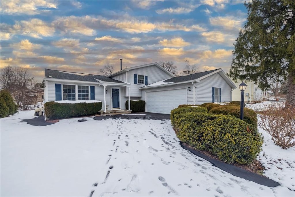 split level home featuring a garage