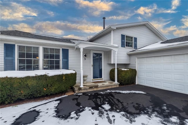 view of front of property with a garage