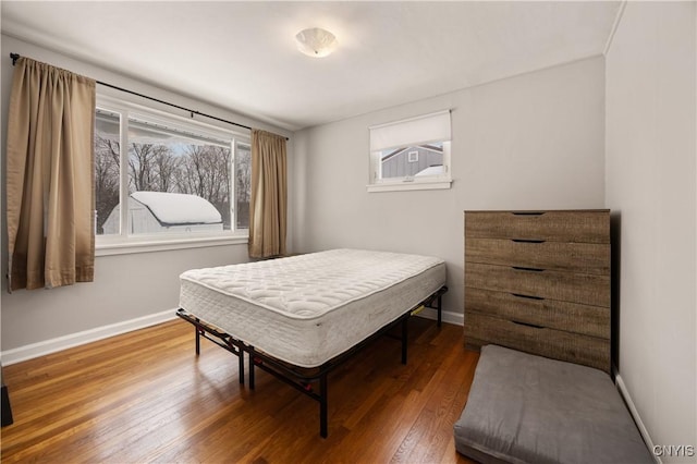 bedroom with hardwood / wood-style flooring