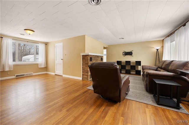 living room featuring hardwood / wood-style floors and a fireplace