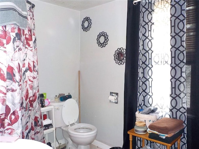 bathroom featuring toilet