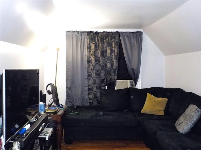 living room featuring lofted ceiling and cooling unit