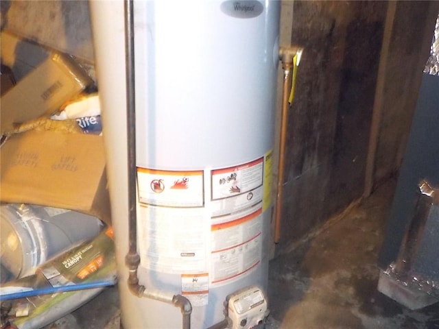 utility room featuring gas water heater