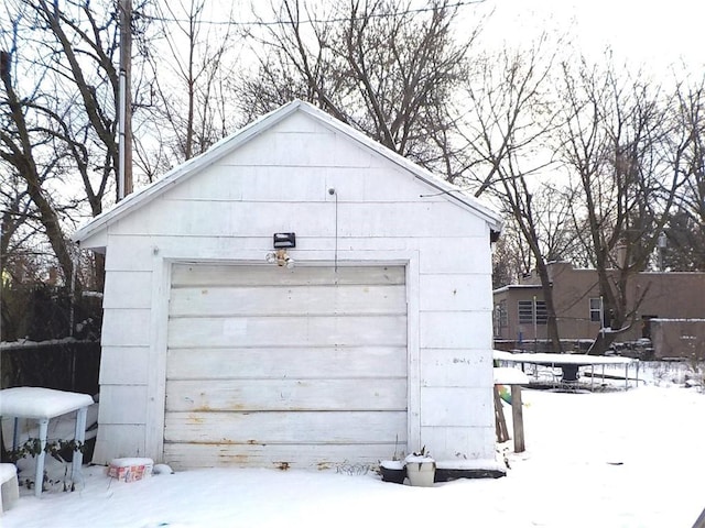 view of snow covered garage