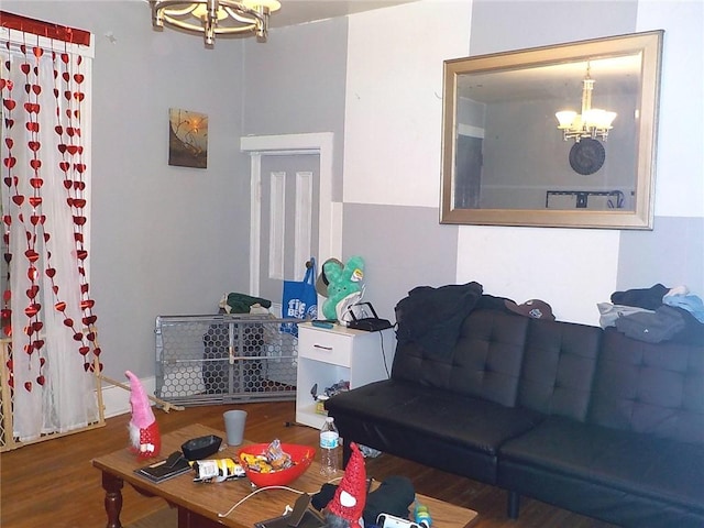 living room with dark hardwood / wood-style floors and a chandelier