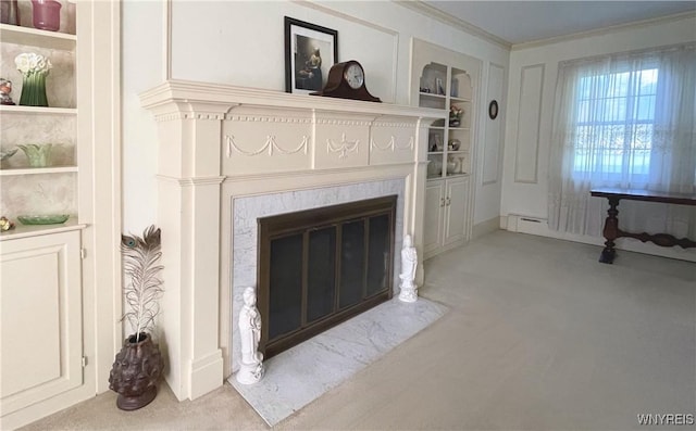 interior details with a fireplace, ornamental molding, built in features, and carpet floors