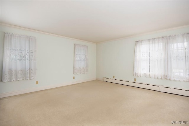 carpeted empty room with baseboard heating and ornamental molding