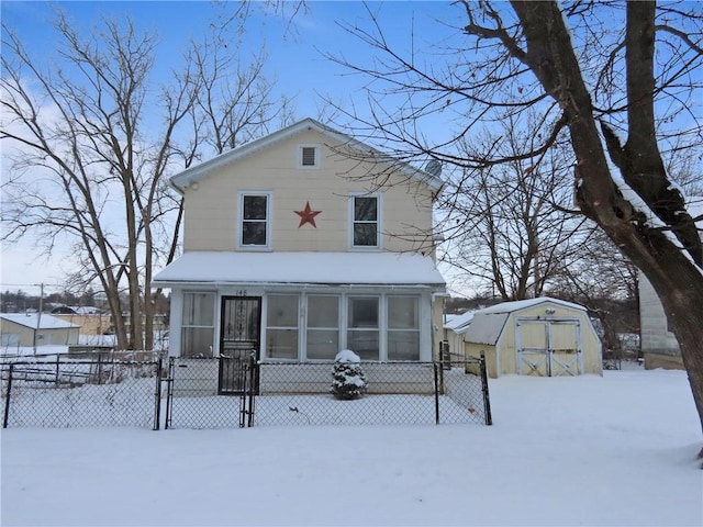 view of front facade featuring a storage shed