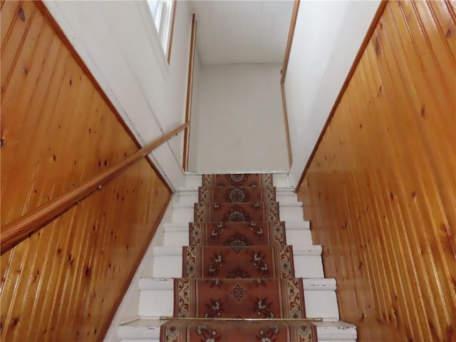 stairs with wood walls