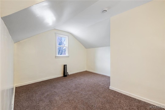 bonus room featuring lofted ceiling and carpet floors