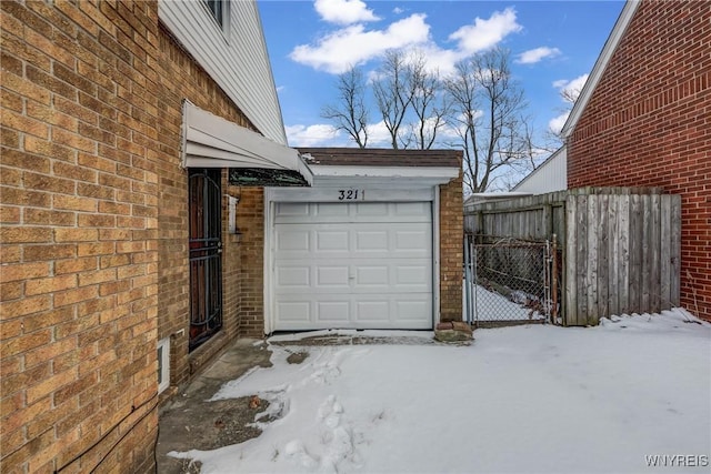 view of snow covered garage