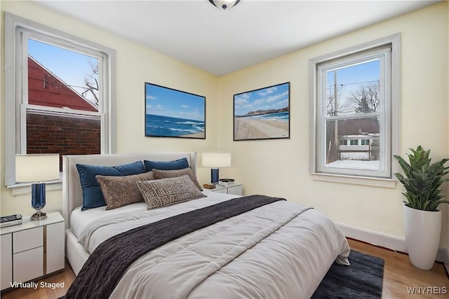 bedroom with hardwood / wood-style flooring