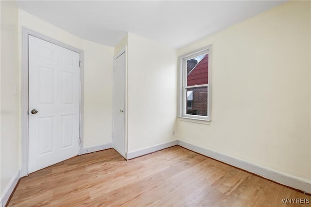 spare room featuring light hardwood / wood-style flooring