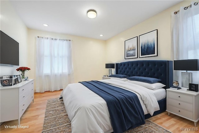 bedroom with light hardwood / wood-style floors