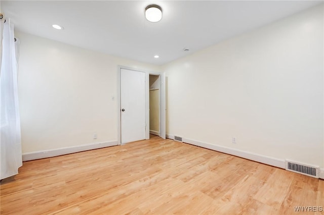 spare room with light hardwood / wood-style flooring