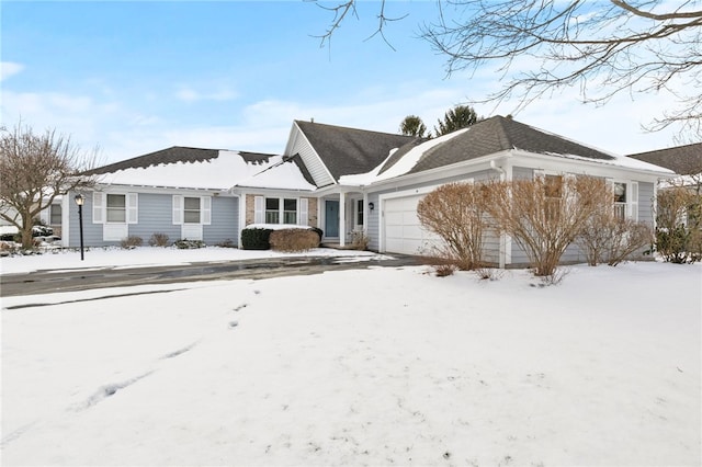 ranch-style home featuring a garage