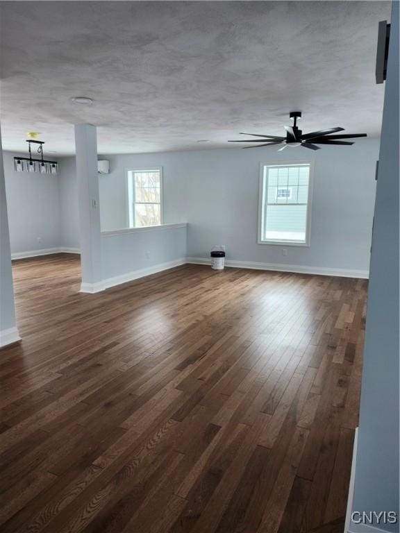 spare room featuring ceiling fan and dark hardwood / wood-style floors