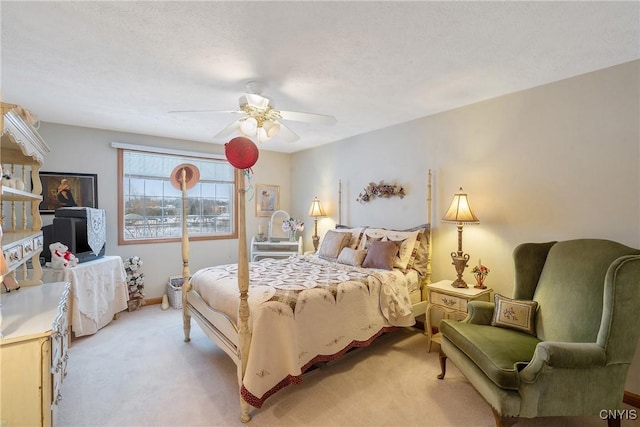 bedroom featuring ceiling fan and light colored carpet