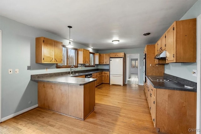 kitchen featuring white refrigerator, dishwasher, kitchen peninsula, light hardwood / wood-style flooring, and black electric stovetop