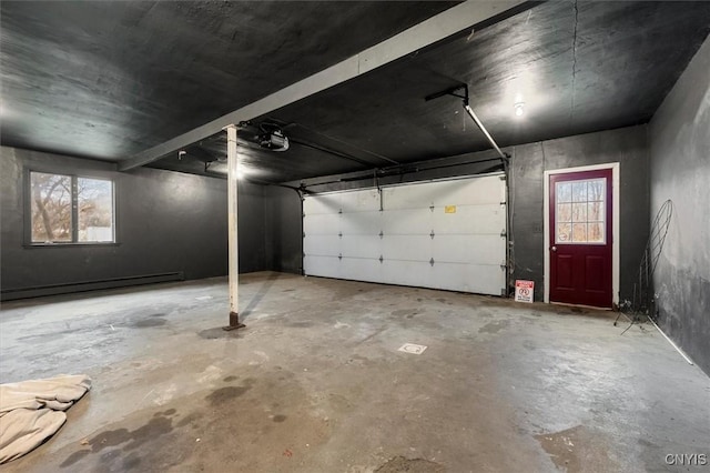 garage with a garage door opener and a baseboard radiator