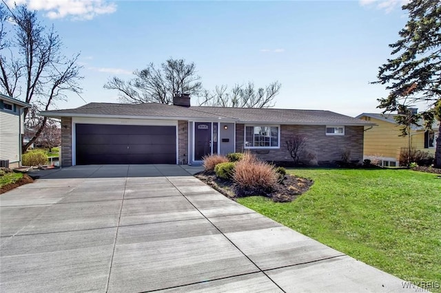 single story home featuring a front lawn and a garage