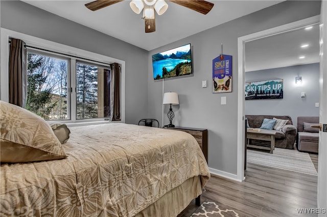 bedroom featuring ceiling fan and hardwood / wood-style flooring