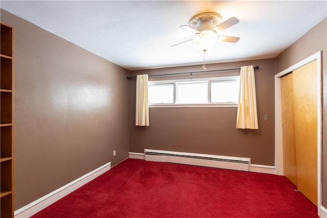 interior space with ceiling fan, a baseboard radiator, and dark colored carpet