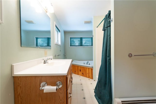 bathroom featuring baseboard heating, a bathtub, and vanity