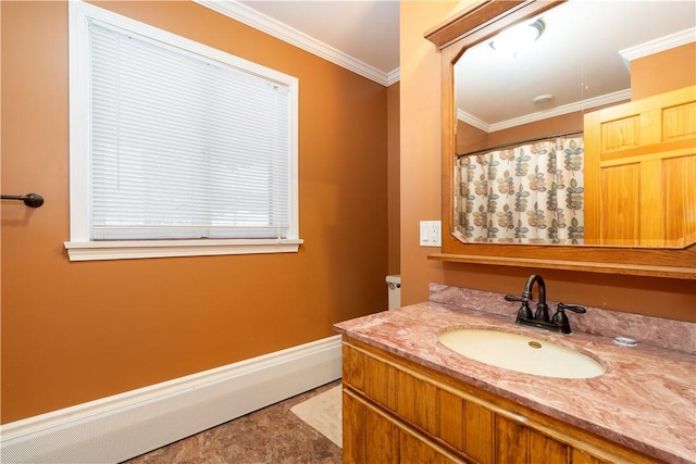 bathroom with crown molding and vanity