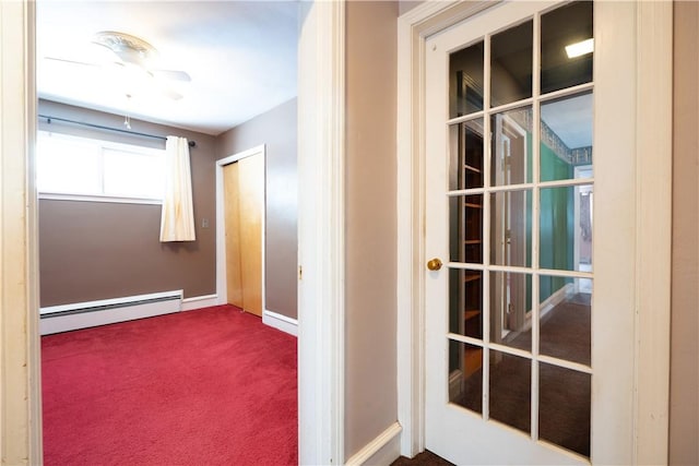 hall featuring carpet floors and a baseboard radiator