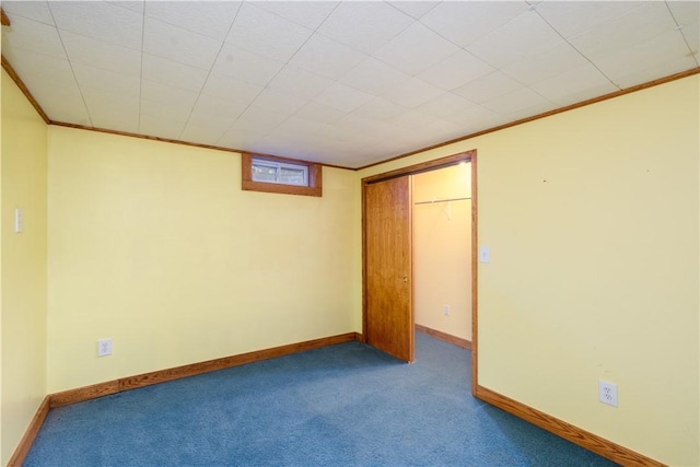 interior space featuring ornamental molding, a closet, and carpet