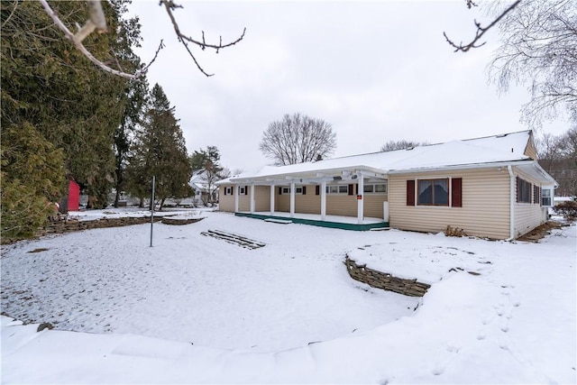 view of snow covered house