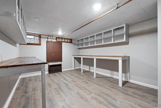 basement featuring hardwood / wood-style floors