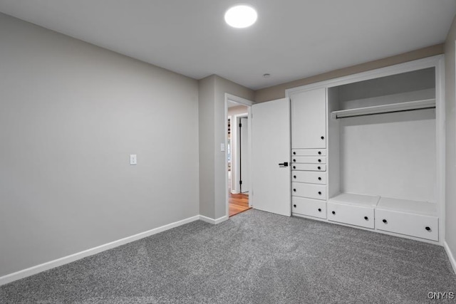 unfurnished bedroom featuring a closet and carpet flooring