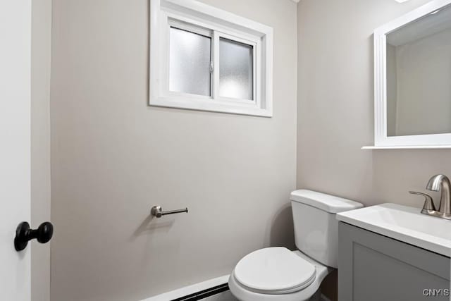 bathroom featuring toilet and vanity