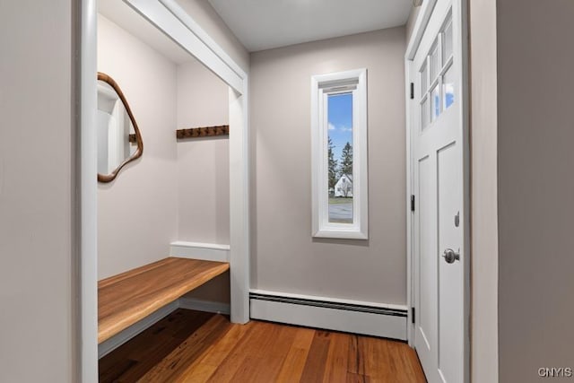 mudroom featuring a baseboard radiator and wood-type flooring