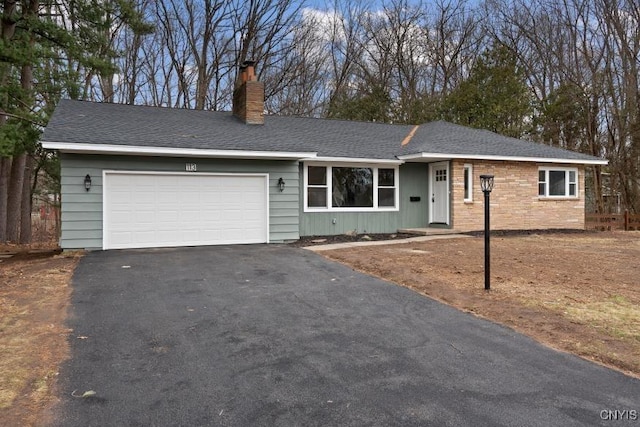 ranch-style house featuring a garage