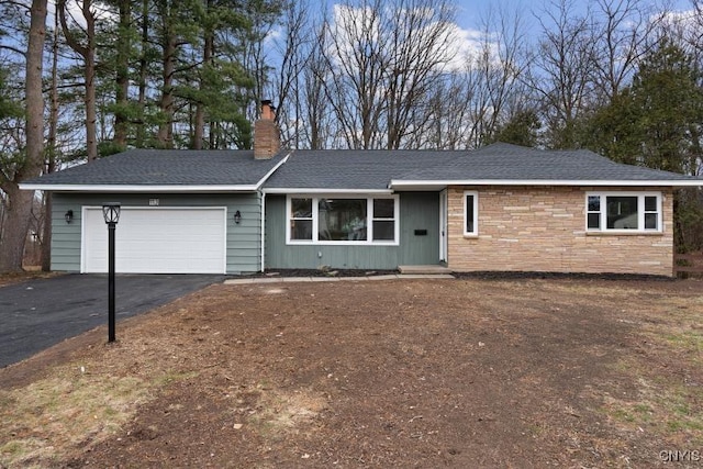 single story home featuring a garage