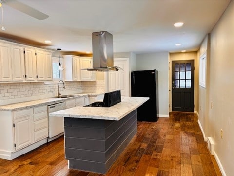 kitchen featuring sink, island range hood, dishwasher, and white cabinetry