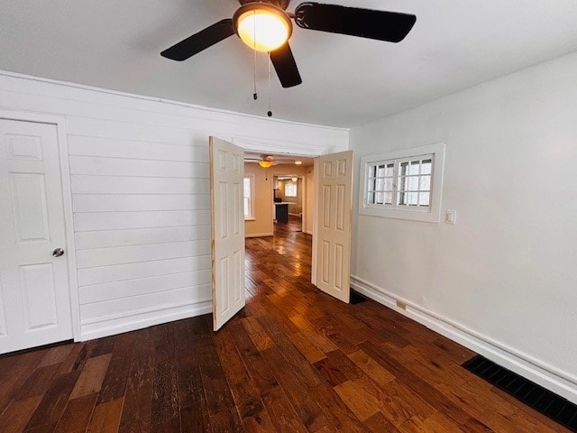 unfurnished room featuring dark hardwood / wood-style flooring