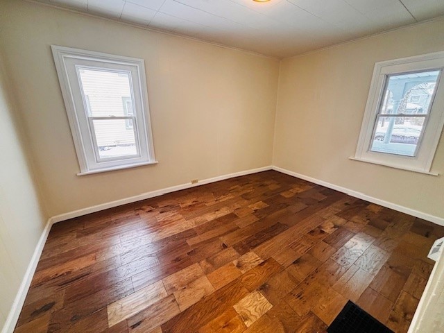 empty room featuring hardwood / wood-style flooring